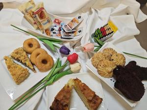 a table topped with plates of different types of food at I Tre Mori in Recanati