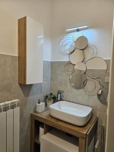 a bathroom with a white sink in a room at I Tre Mori in Recanati