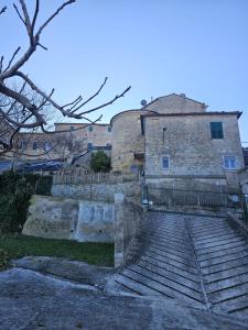 a set of stairs in front of a building at I Tre Mori in Recanati