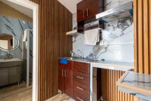 a bathroom with a sink and a mirror at Chapalita Grand House in Guadalajara +96 photos