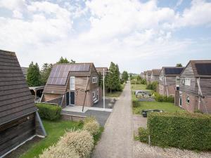 a row of houses with solar panels on their roofs at Getaway with Bikes & Whirlpool in Grou