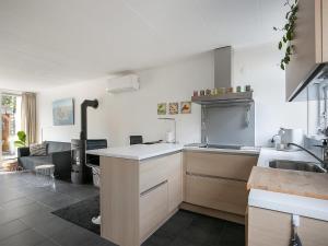 a kitchen with a sink and a stove top oven at Getaway with Bikes & Whirlpool in Grou