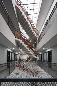 an empty gym with stairs in a building at Cove Casa Dyna in Jakarta