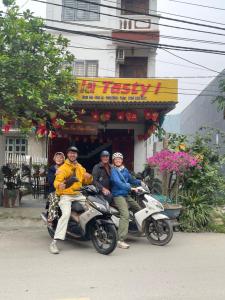 a group of people riding motorcycles in front of a store at Tam Coc Hope House in Ninh Binh +39 photos