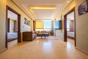 a living room with a couch and a bed at Singular Hotel, SH Dakhla in Dakhla +25 photos