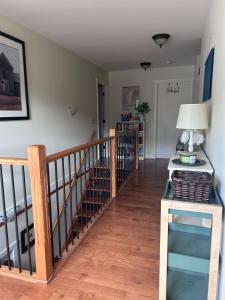 a living room with a staircase with a lamp at Mountain Guesthouse Bed and Baking in Radium Hot Springs