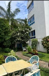 a table and chairs in front of a building at Sunrise-Nyali, Mombasa in Nyali