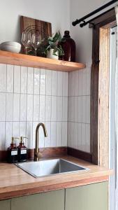 a kitchen with a sink and a counter top at Bluff Shacks in Whitemark