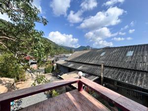 a view from the deck of a house with a roof at Blueka Hostel Ko Chang in Khlaung Phai Bae