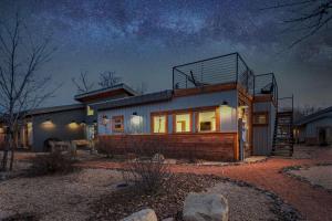 a house at night with a starry sky at Timber & Tin D 2Bed 2Bath w Pool & Rooftop Deck in Kanab