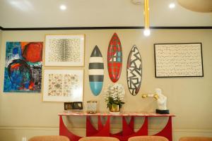 a room with surfboards hanging on a wall at Ambiance Boutique Art Hotel Karachi in Karachi