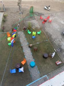 an aerial view of colorful tables and chairs at Nirvana Maldevta in Dehradun