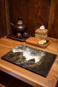 a table with a map of the world on it at Dapur Alit Villas in Yogyakarta +9 photos