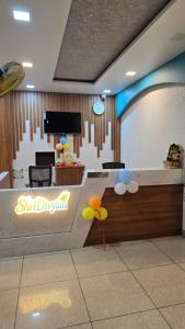 a room with a stage with balloons on the wall at SHRI DIVYAM Hotel & Restaurant in Bhopal
