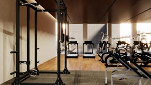 a gym with several treadmills and cardio machines at Brisdale International Kuala Lumpur in Kuala Lumpur