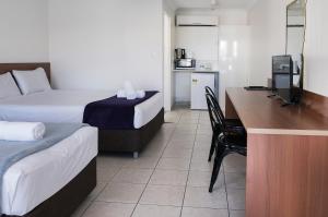 Postel nebo postele na pokoji v ubytování Sunshine Beach Resort