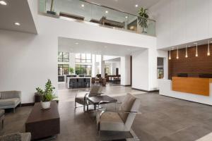 a lobby with chairs and a table and a living room at Wingate by Wyndham Hurricane Zion National Park in Hurricane +67 photos