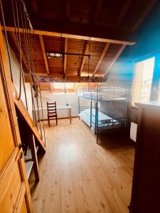 a room with a bunk bed and a table at Comme à la maison à la montagne in Briançon