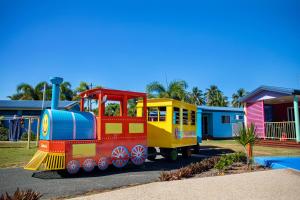 a colorful train is parked in a park at Ingenia Holidays Conway Beach in Conway