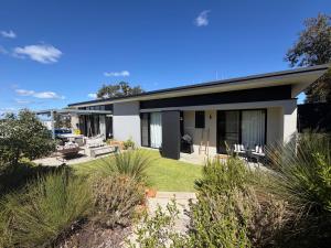 a house with a garden in front of it at Carnarvon Castle Eagle Bay in Dunsborough