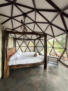 a bedroom with a bed in a tent at Domo Alto del Monte in Alto del Monte