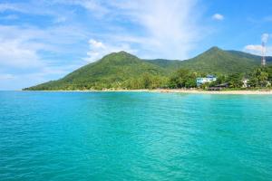 a view of a beach with mountains in the background at Beachfront 4BR Villa with Private Pool - Ocean Access in Chaloklum +92 photos