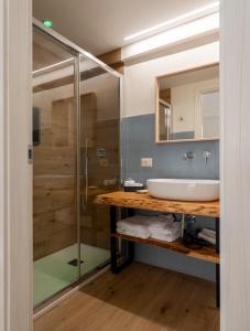 a bathroom with a sink and a shower at Terrazza Campailla in Modica