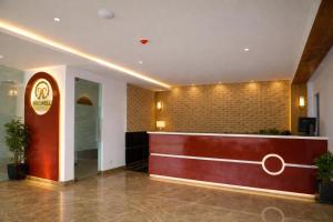 a lobby of a hotel with a reception desk at Hotel Prowell Apex - Kondapur in Hyderabad