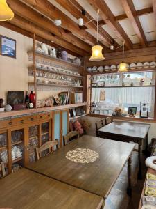 a dining room with wooden tables and chairs at Polar Bear 藏王白熊民宿 in Kaminoyama