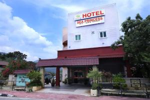 a hotel sign on the side of a building at Hotel D'Sea Princess in Tanjung Bungah