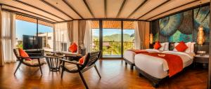 a bedroom with a large bed and a large window at Amiana Resort Cam Ranh in Cam Ranh +288 photos