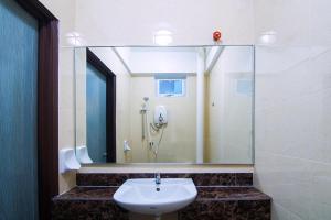 a bathroom with a sink and a shower at Hotel D'Sea Princess in Tanjung Bungah +17 photos