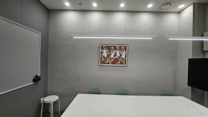 a meeting room with a white table and chairs at SunU Seoul Stay - All Rooms 45m Panoramic Han River View - 4m Ceiling in Seoul