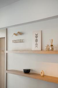 a shelf in a living room with wooden shelves at Mintara Hotel - โรงแรมมินธารา มีนบุรี in Min Buri +73 photos