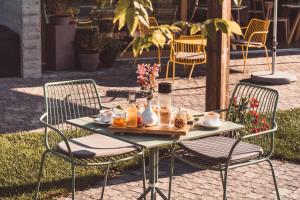 a table and chairs with food and drinks on it at Ca' San Matteo in Tesserete