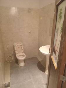 a bathroom with a toilet and a sink at Villa i in Dehiwala +23 photos