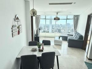 a living room with a table and chairs at Vortex Suites KLCC by Chia in Kuala Lumpur
