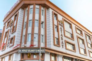 a building with a street sign in front of it at Hotel Atabay in Istanbul