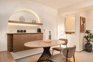 a dining room with a table and chairs at Chariclea Villas Retreat in Samos +114 photos