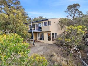an aerial view of a house with trees at Salty Haven in Moggs Creek