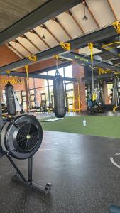 a gym with two boxing bags hanging from the ceiling at Elara in Sandton