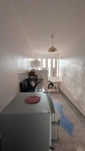 a kitchen with a sink and a counter top at Hostel Assafar in Ouarzazate