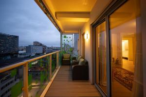 a balcony of a building with a view of a city at Sky Two La Defense in Courbevoie