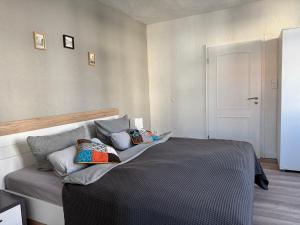 a bedroom with a bed with pillows on it at Ferienapartment Weimar Altstadt 1 in Weimar
