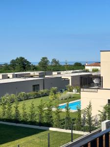 an aerial view of a building with a swimming pool at Villa Oasis Poreč in Labinci
