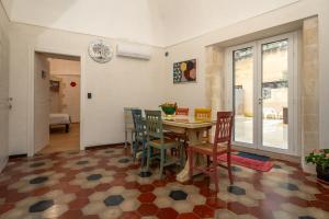 a dining room with a table and chairs at Terrazza Campailla in Modica