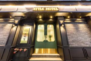 a front door of a sykes house at night at STYLE Hotel in Seoul +6 photos