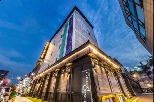a building with a sign on the side of it at STYLE Hotel in Seoul