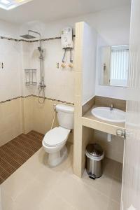 a bathroom with a toilet and a sink at Hi2 Cha-Am in Cha Am +36 photos