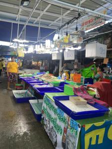 a market with several tables of food on them at Hi2 Cha-Am in Cha Am